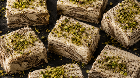 Marbled tahini halva cut into blocks with pistachios